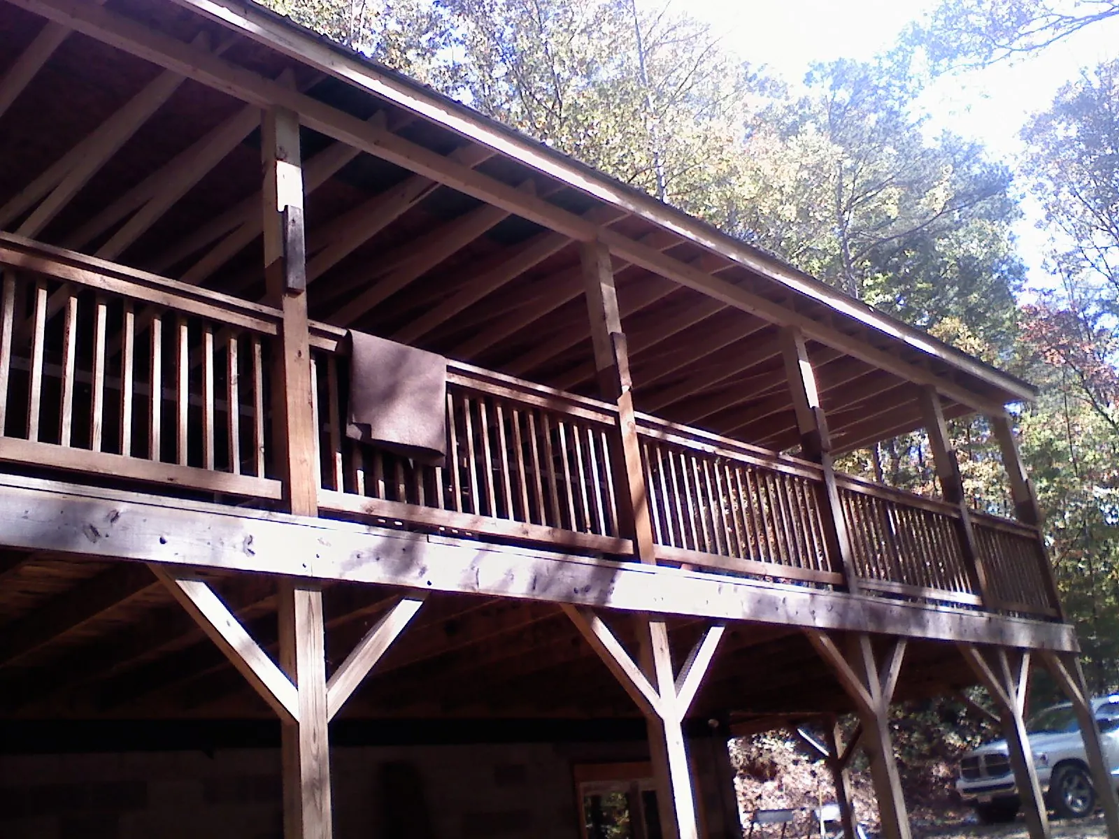 Timber framing under a new elevated porch and deck — Roof Leak Repair in Bainbridge by Roofing Brothers